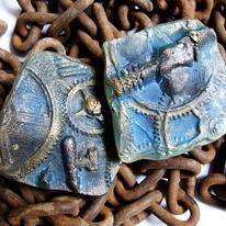 Glass casts with metal inclusions.
