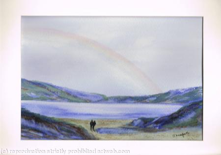 Rainbow over water with couple