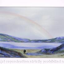 Rainbow over water with couple
