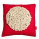 cream on red felt looped…