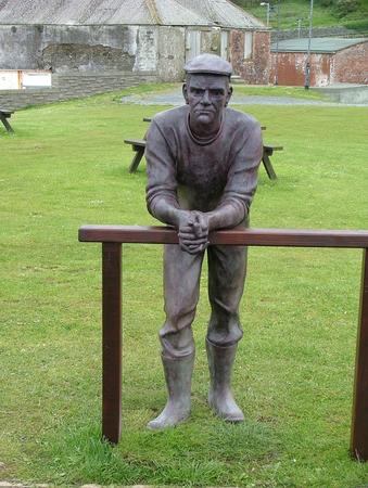 Man on the Beach, Port William, Scotland by Andrew Brown