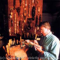 Mike carving in his studio