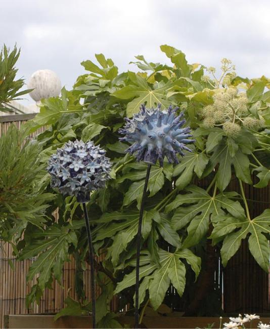 Globe Thistles on a roof terrace stoneware, wood and metal width=