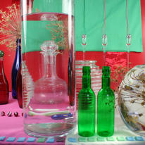Decanter Through Water With Green Bottles