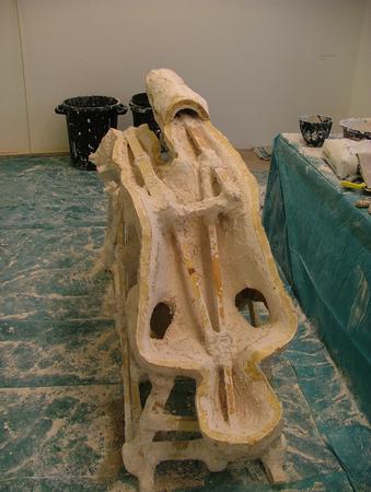 Front half of the mould is filled with plaster (1 inch thick) whitch is strengthened by a wooden skeleton.