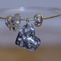 Hand Crafted Sterling Silver Charm Bangle With Unique Sterling Silver Charms