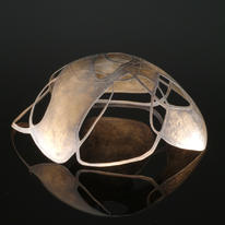 raised, etched and pierced bowl