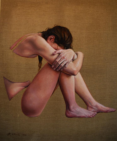 Girl with head bowed