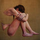 Girl with head bowed