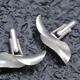 Curl cufflinks