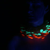 Lumini necklaces worn, glowing