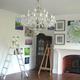 Hanging more paintings.