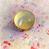 Bowl on pink and blue fabric