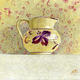 Jug and patterned wallpaper