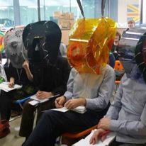 Outside examine board wearing the hoods for the Q and A