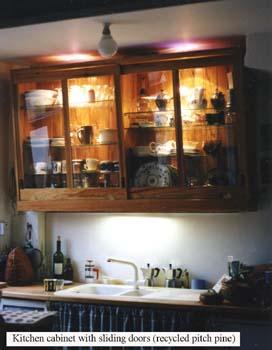 Wall cabinet with glass sliding doors