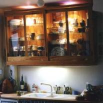 Wall cabinet with glass sliding doors