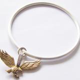 Flying high, high, I'm a bird in the sky - Satin finish sterling silver bangle with 9ct gold Eagle set with 2 diamonds