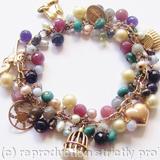 Wishes, Hopes - 9ct vintage gold charm bracelet with precious stones