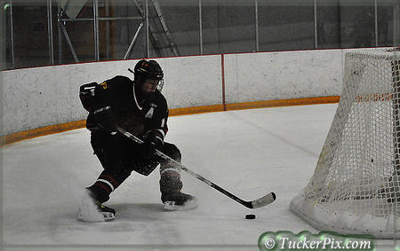 Behind the net