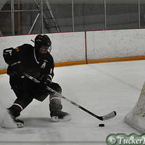 Behind the net