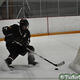 Behind the net