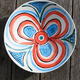 red swirl on blue large…