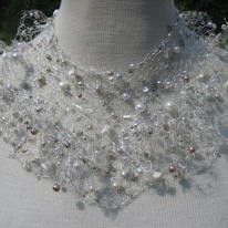 Frily edged silver collar