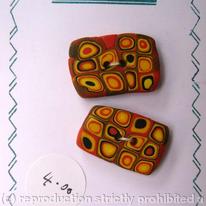2 orange n yellow n black lots of circles