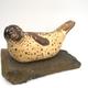 Seal at Rest | | | Burnished clay, smoke fired and waxed on stone base Seal at Rest